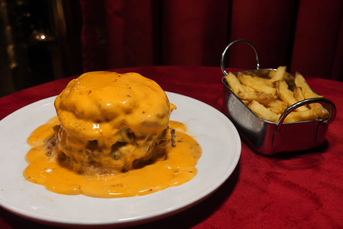 Burger with melted cheddar and fries